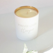 A close-up of the Forever Loved Custom Engraved Candle’s elegant engraving, embodying sentimental remembrance and refined floral notes.